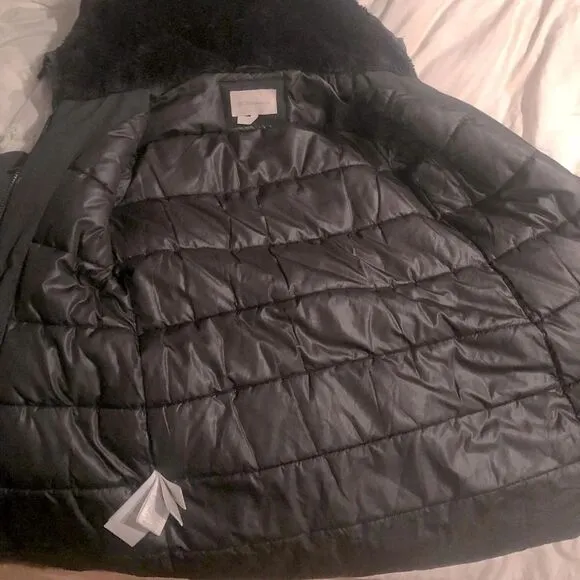 BCBG black XS mid length parka, front zip, quilted interior, faux fur hood